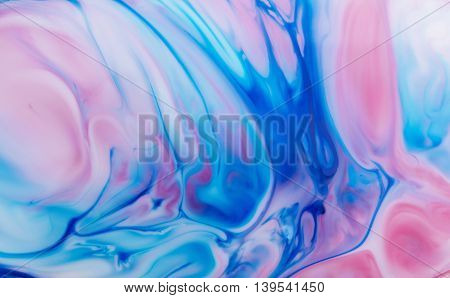 Blue and pink abstract art space paint stains background