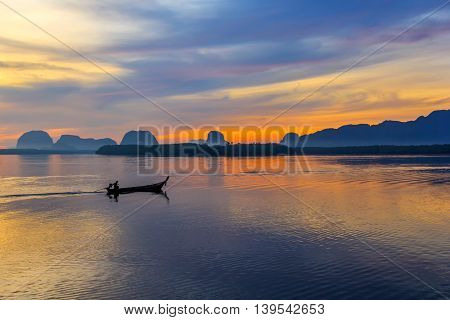 fisherman on local fishing boat at Samchong fishing village on sunrise in Phang-NgaThailand
