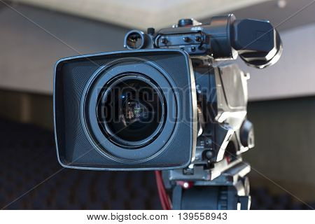 Professional Digital Video Camera. Tv Camera In A Concert Hal.