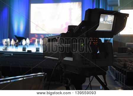 Professional Digital Video Camera. Tv Camera In A Concert Hal.