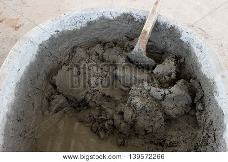 building construction wall. mix cement plaster concrete in bucket