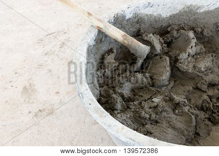 building construction wall. mix cement plaster concrete in bucket