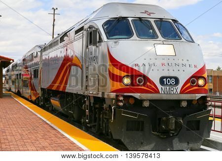 ALBUQUERQUE, USA - MAY 24, 2015: Engine and bilevel cars of the New Mexico Rail Runner Express at the station.