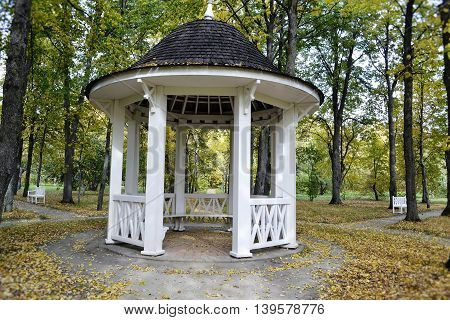 gazebo in the estate-museum Tarkhany Penza region of Russia on a background of fallen leaves in autumn public place