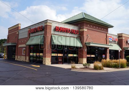 SHOREWOOD, ILLINOIS / UNITED STATES - AUGUST 30, 2015: One may eat burritos and other Mexican food at the Burrito Rico restaurant, in a Shorewood strip mall.