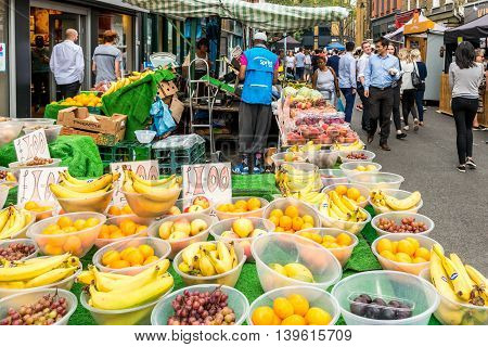 London United Kingdom - July 22 2016: Leather Lane Street Market - street in Holborn with great streetfood fruit and vegetables and clothes stalls very popular with office workers Monday to Friday