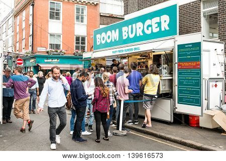 London United Kingdom - July 22 2016: Leather Lane Street Market - street in Holborn with great streetfood fruit and vegetables and clothes stalls very popular with office workers Monday to Friday