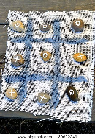 Vintage tick tack toe game handmade in the old west.