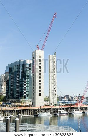 Boston Massachusetts USA - June 23 2016: Crane looms over construction on 50 Liberty project