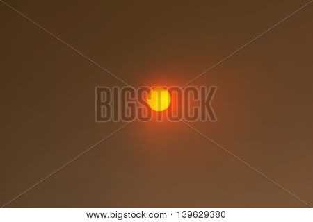 Sun Peeking Through Smoke Clouds From Wildfire.