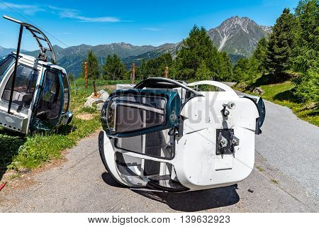 Close view on destroyed wagoons of the ski station