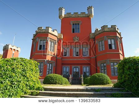 Romantic castle with red facade. Hradek u Nechanic. Czech Republic. Nechanice. July 7, 2016