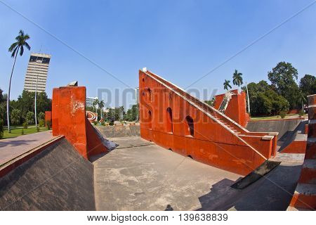 Astronomical observatory Jantar Mantar in Delhi under blue sky