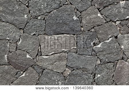 typical wall made seamless from volcanic stone