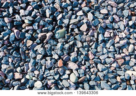 Texture colored crushed gravel with admixture of river pebbles