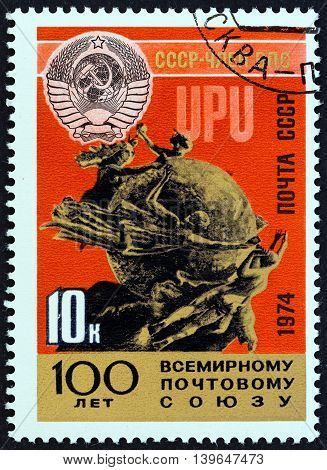USSR - CIRCA 1974: A stamp printed in USSR issued for the Centenary of U.P.U. shows Soviet Crest and U.P.U. Monument, Berne, circa 1974.
