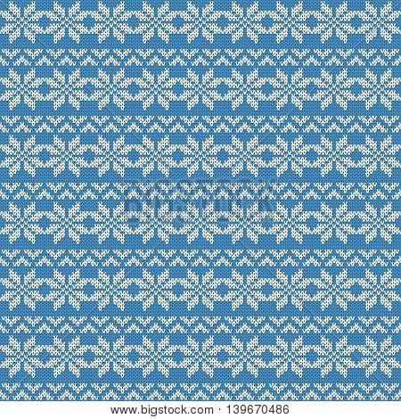 Repeating knitted seamless pattern with flowers and stripes with triangles. Woolen texture with a jacquard pattern. Abstract winter holiday design. Sweater ornament