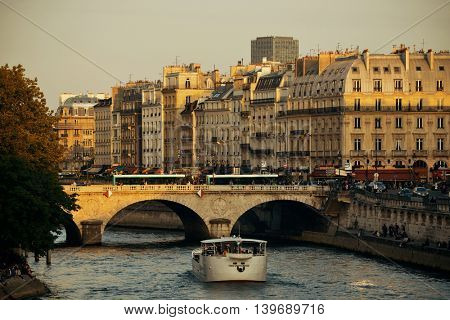 PARIS, FRANCE - MAY 13: Historical architecture and River Seine at sunset on May 13, 2015 in Paris. With the population of 2M, Paris is the capital and most-populous city of France