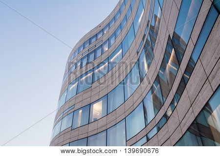Modern Curving Window Glass Tile Architecture in Düsseldorf with Blue Sky