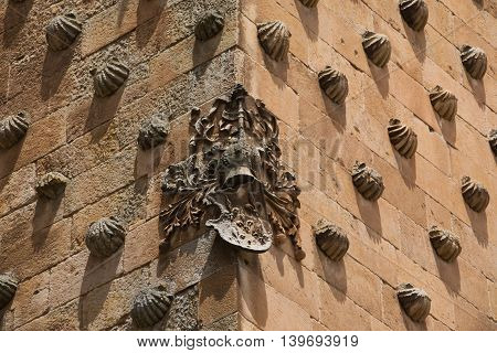 Corner of the palace Casa de las Conchas in Salamanca
