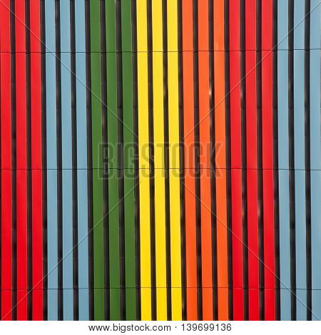 The set of all colors of the rainbow. Vertical rectangles of metal