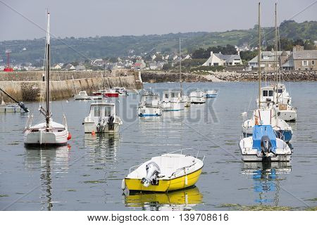 Small fishing boats waiting in port France water reflection