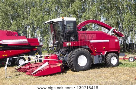 Harvester machine to harvest wheat field working. Combine harvester agriculture machine harvesting golden ripe wheat field. Agriculture
