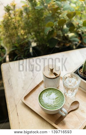 Hot Green Tea Set On A Wooden Table In A Coffeshop