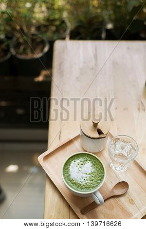 Hot Green Tea Set On A Wooden Table In A Coffeshop