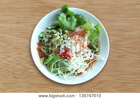Local Thai foods of Rice Vermicelli is name KHANOM CHINspicy noodles with vegetable and hot soup.