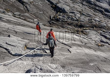 Ranau,Sabah,Borneo-March 13,2015:Group of climbers move down from Low's Peak to Sayat-Sayat check point at Mountain Kinabalu.Sabah