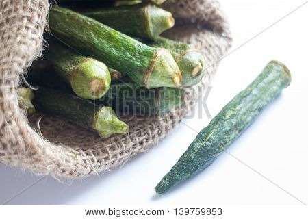 Healthy okra chips on clean background stock photo