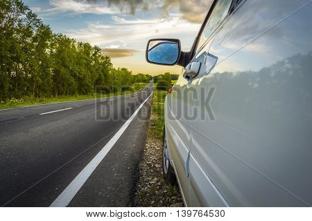 The car stopped at the roadside rural road