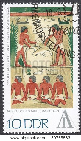 MOSCOW RUSSIA - CIRCA FEBRUARY 2016: a post stamp printed in DDR shows fowling scene Egypt the series 