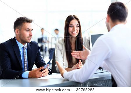Business people speaking during interview in their office