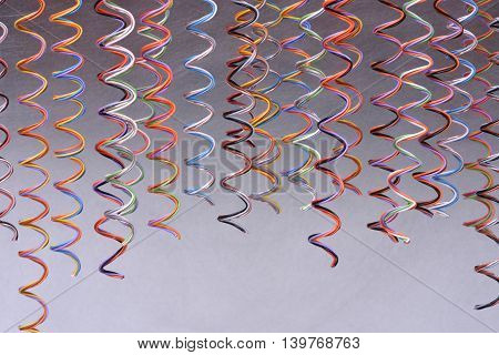 Colored telecommunication cables and wires on white background