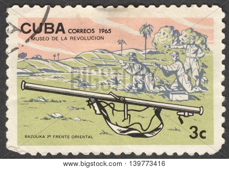 MOSCOW RUSSIA - JANUARY 2015: a post stamp printed in CUBA shows a bazooka gun and soldiers the series 