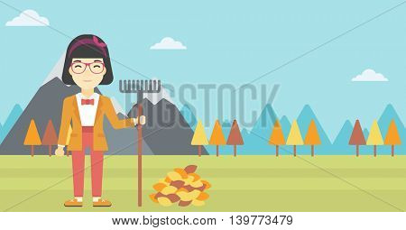 An asian young woman raking autumn leaves. Woman with rake standing near tree and heap of autumn leaves. Woman tidying autumn leaves in garden. Vector flat design illustration. Horizontal layout.