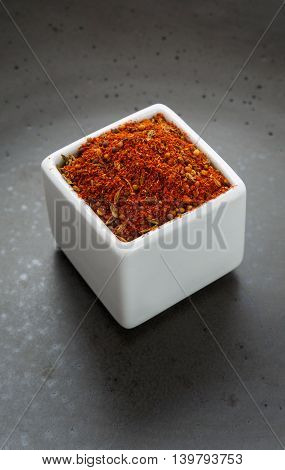 Oriental herbs spice mix on dark ceramic dish