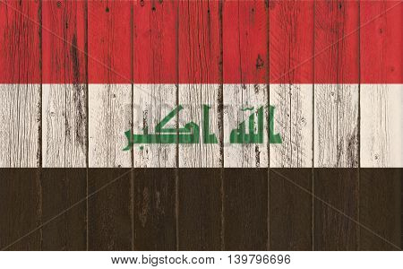 Flag of Iraq painted on wooden frame