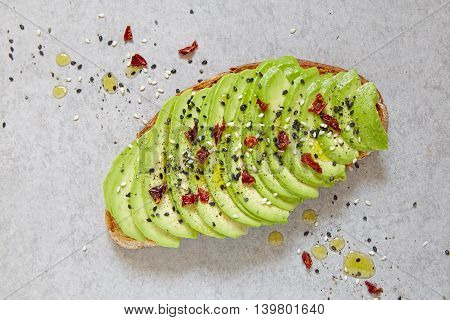 sliced avocado on toast bread with spices