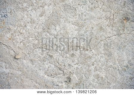 Gray cracked concrete texture background close up
