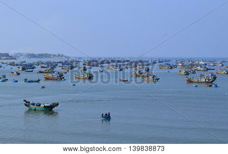 fishing village with many traditional basket boats and ship in muine sea vietnam