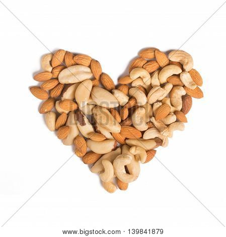 Almond cashew and Para nuts heart shaped in white background