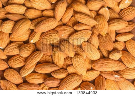 Close-up on Almonds over a wooden table
