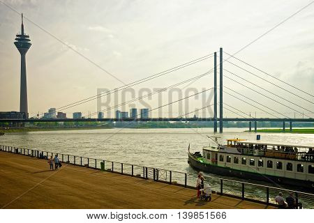 Rheinturm Tower And Rhine Embankment Promenade In Dusseldorf
