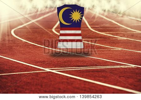 Red Running Track With Lines And Malysia Flag On Shirt