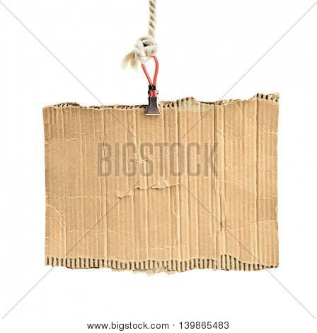 old piece of cardboard on rope for message
