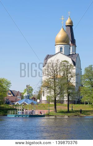 SESTRORETSK, RUSSIA - MAY 15, 2016: Peter and Paul Church on the lake Sestroretsky Razliv, sunny may day. Religious landmark  of the city Sestroretsk, Russia