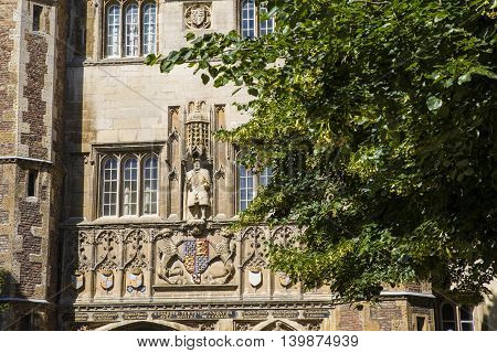 A view of the King Henry VIII statue on the magnificent gatehouse of Trinity College in Cambridge UK. King Henry VII founded Trinity College in 1546.
